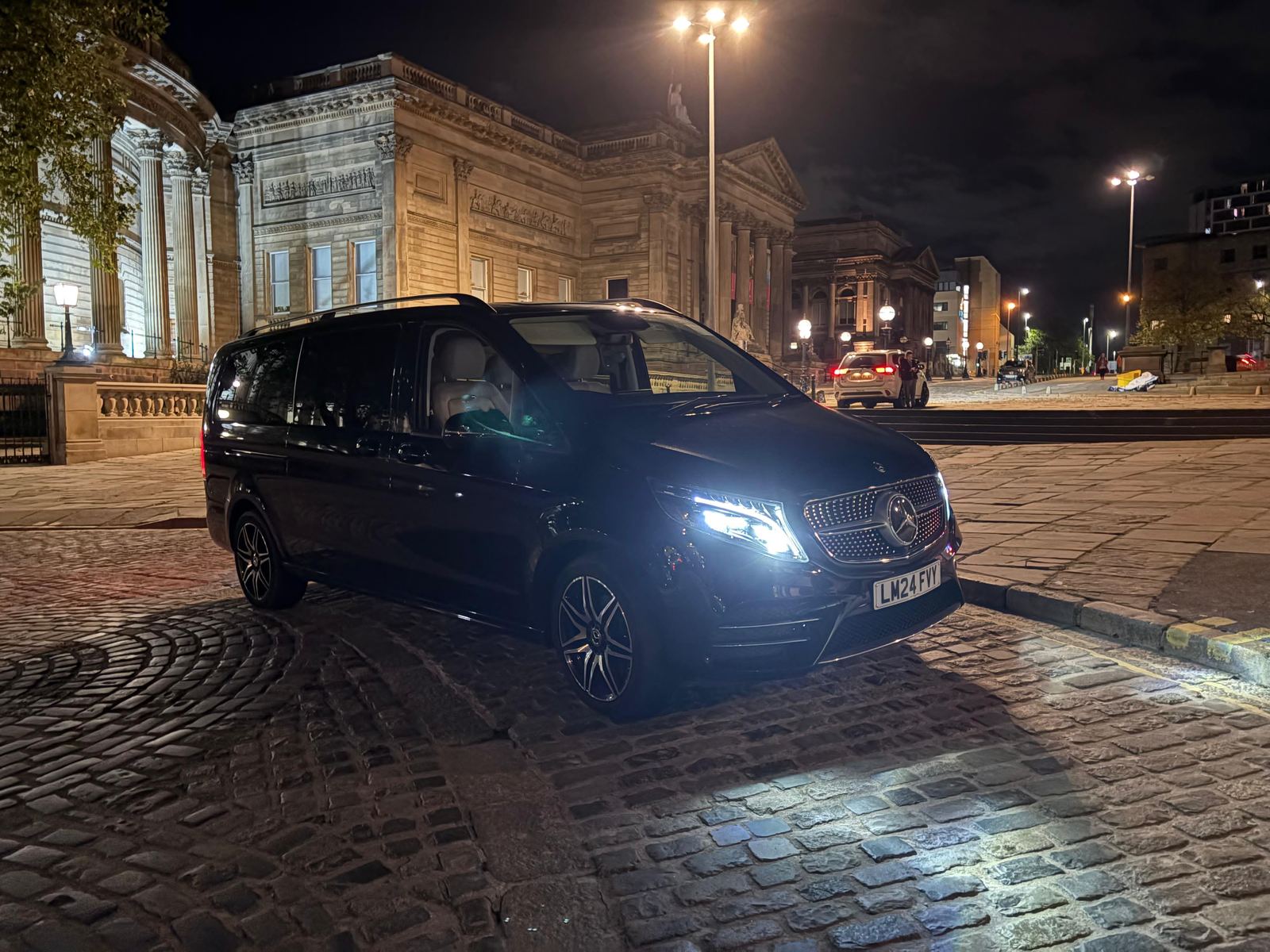 AO Platinum Chauffeurs Jet-Class in Liverpool city centre at night, near St George's Hall